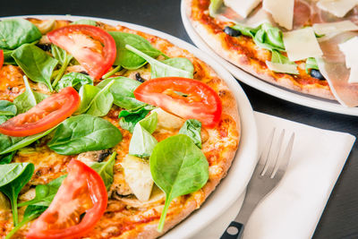 Close-up of pizza served on table