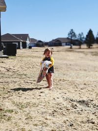 Full length of girl on field