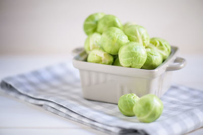 Close-up of vegetables in container on table