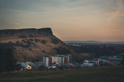 Buildings against sky during sunset