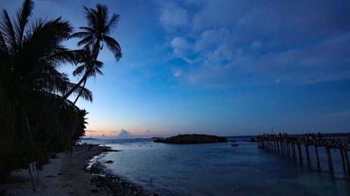 Scenic view of sea against sky at sunset