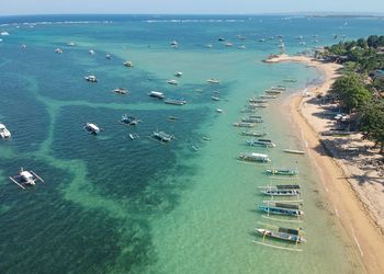 High angle view of boats on sea shore