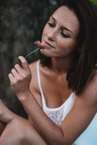 Close-up of woman holding cigarette