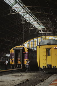 Train at railroad station in city