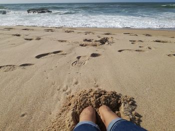 Low section of man at beach