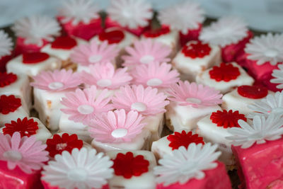 Colorful petit fours with flower decoration