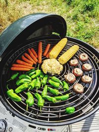 High angle view of meat on barbecue grill