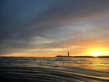 Scenic view of sea against sky at sunset