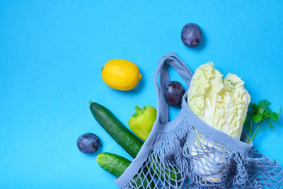 High angle view of fruits against blue background