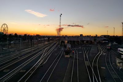 High angle view of railroad tracks against sky during sunset