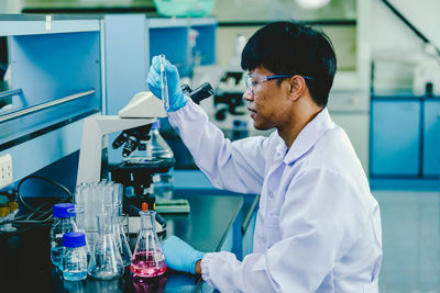 Scientist analyzing medical sample in laboratory