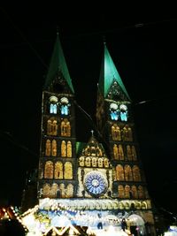 Low angle view of illuminated building at night