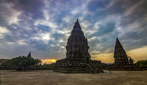 View of temple building against cloudy sky