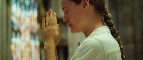 Side view of young woman looking away