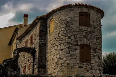 Low angle view of old building against sky