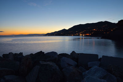 Scenic view of sea against clear sky during sunset