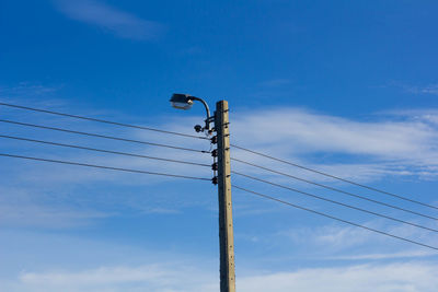 Low angle view of street light against sky