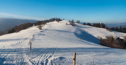 Scenic view of snow covered mountain against sky