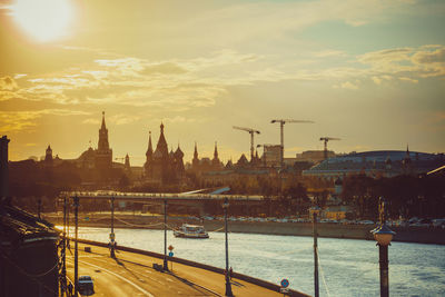 City at waterfront during sunset