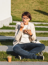 Woman with take away lunch box, cup of coffee. healthy bowl with vegetables. healthy nutrition.