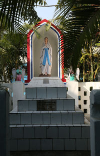 Statue against blue sky