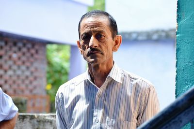 Portrait of man standing outdoors