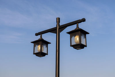 Low angle view of street light against sky