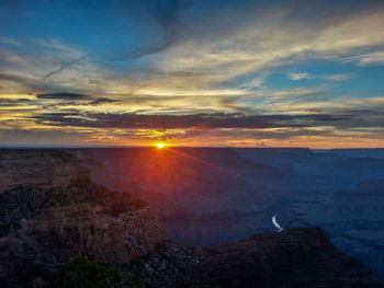 Scenic view of landscape against sky during sunset