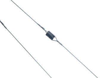 Low angle view of cables against white background