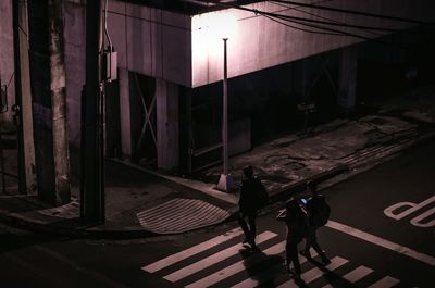 People walking on staircase in city