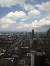 High angle view of modern buildings in city against sky