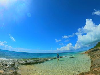 Scenic view of sea against blue sky