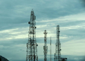 Low angle view of electricity pylon against sky