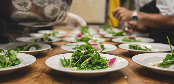 Close-up of salad in plates on table