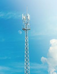 Low angle view of communications tower against sky