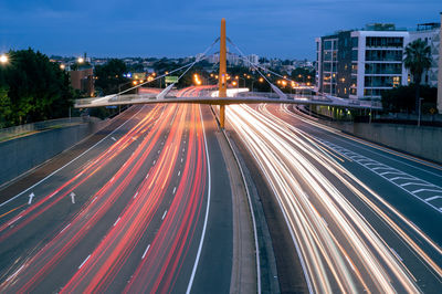 High angle view of light trails on road at night