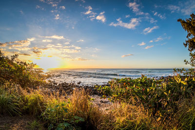 Scenic view of sea against sky at sunset