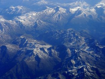 Aerial view of snow covered mountains