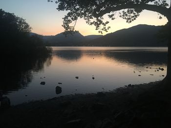 Scenic view of lake against sky during sunset