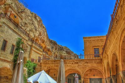 Low angle view of historical building against blue sky
