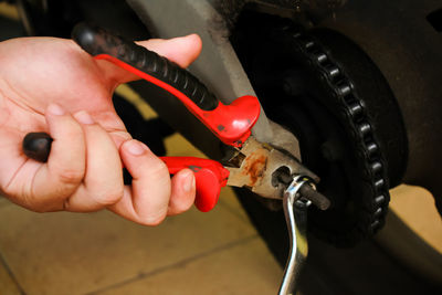 Midsection of person working in machine