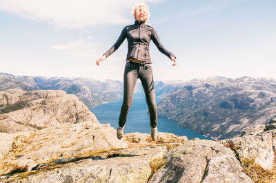 Happy woman on mountain