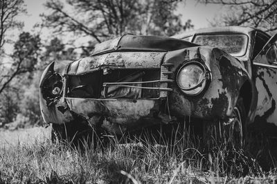 Front of an abandoned volvo pv 444. a swedish car manufactured during 1944-1957