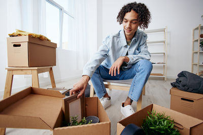 Portrait of young woman working at home