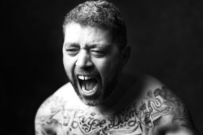 Close-up portrait of a shouting man