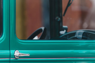 Close-up of vintage turquoise car