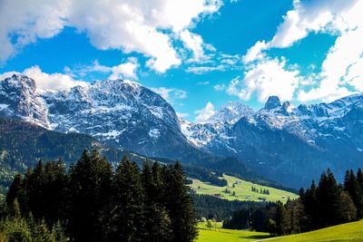 Scenic view of mountains against cloudy sky