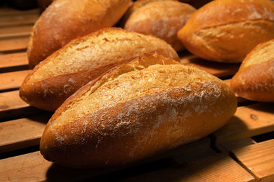 Close-up of sourdough bread. freshly baked bread with a golden crust on the wooden shelves