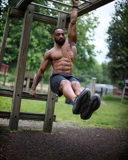 Full length of man exercising in gym