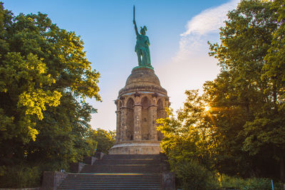 Low angle view of statue against sky